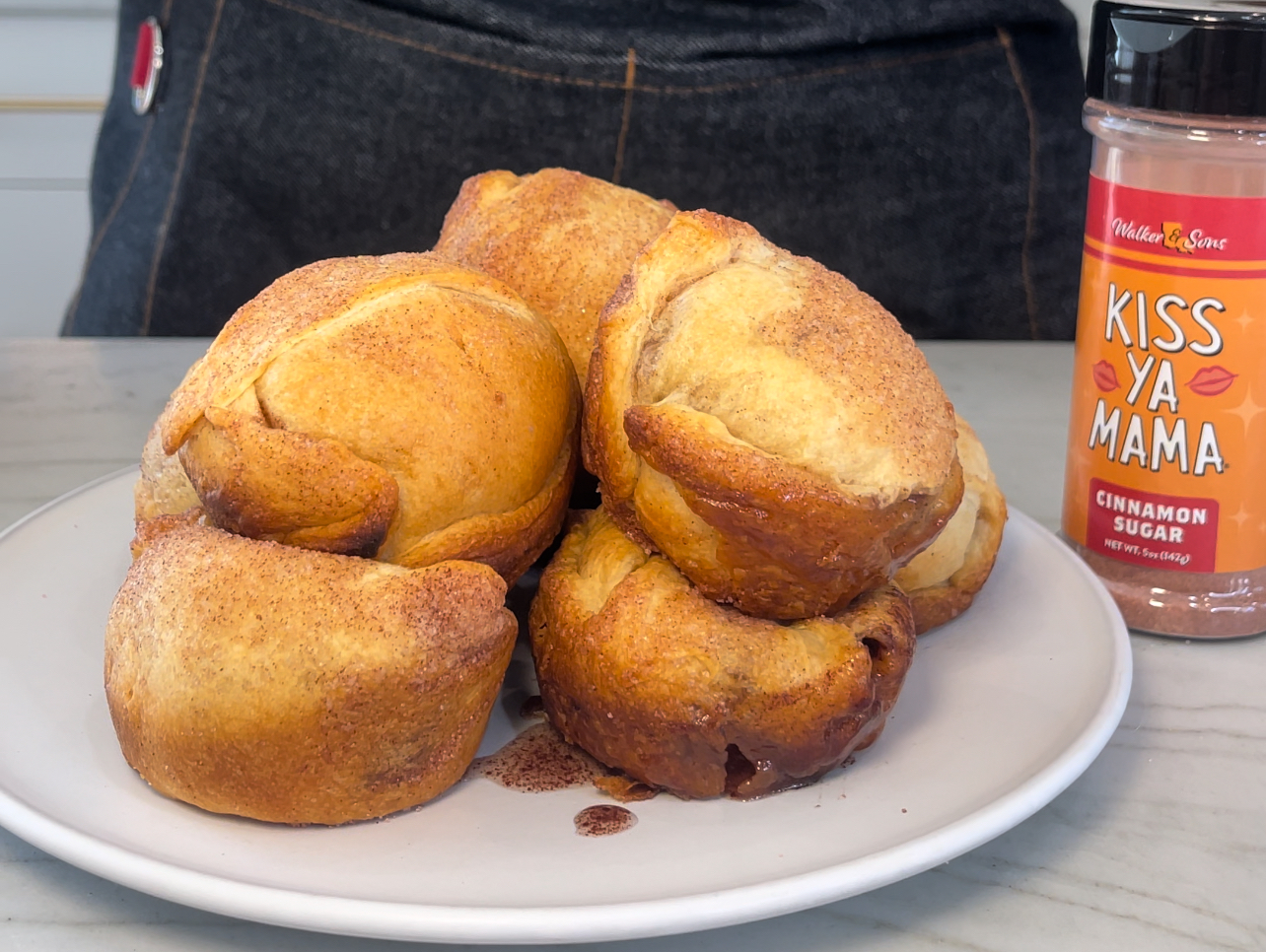 Hocus Pocus rolls with a bottle of Kiss Ya Mama Cinnamon Sugar