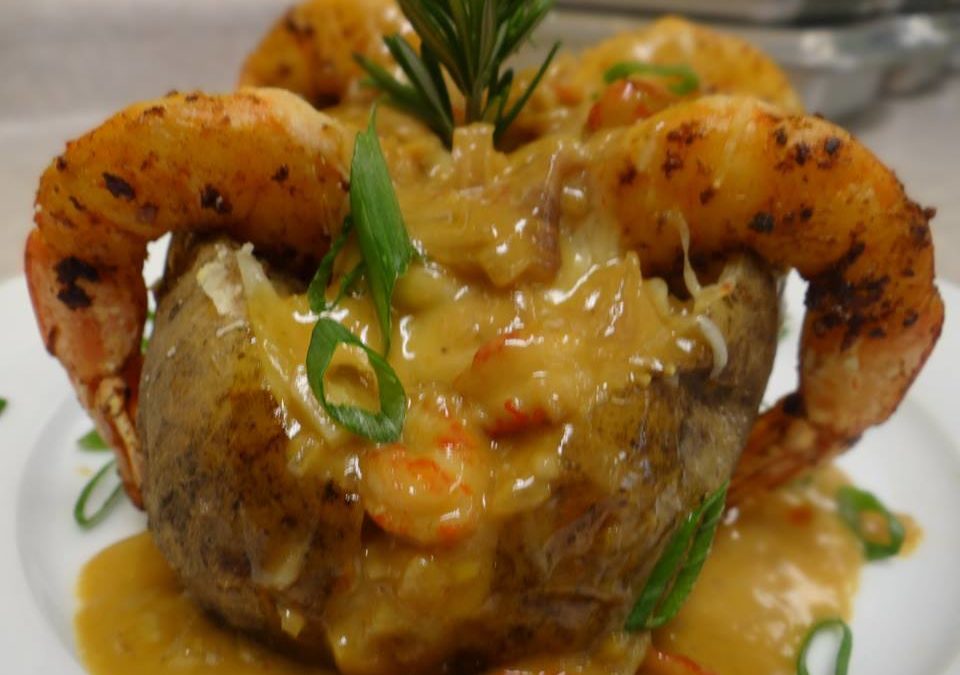 Seafood Stuffed Potato with a Creamy Crawfish Sauce